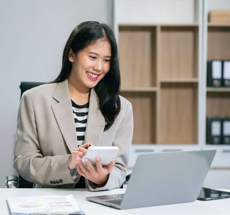 Businesswomen working with smart phone and laptop and digital tablet computer